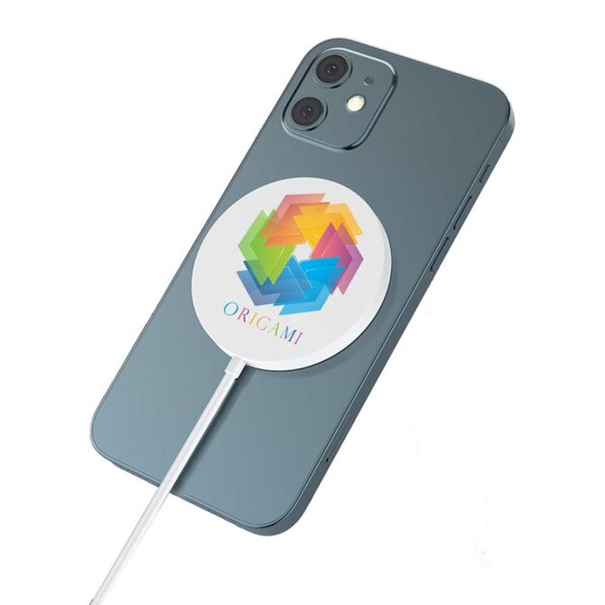 A magnetic wireless charger in a circular design with a colourful logo, placed on a smartphone. The charger is white.