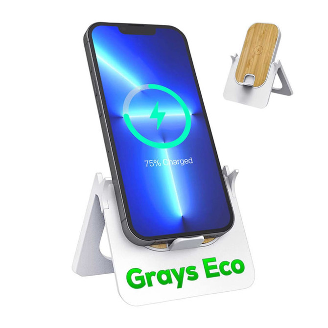 A wireless charging stand in white with a bamboo platform, holding a smartphone displaying a charging symbol.