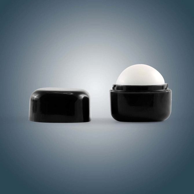 A black cube-shaped lip balm container with a removable lid, featuring a rounded white balm inside.