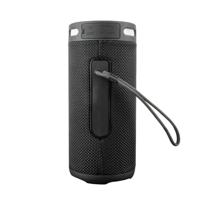 A black wireless speaker with a textured surface, featuring a carry strap and a logo on the side.