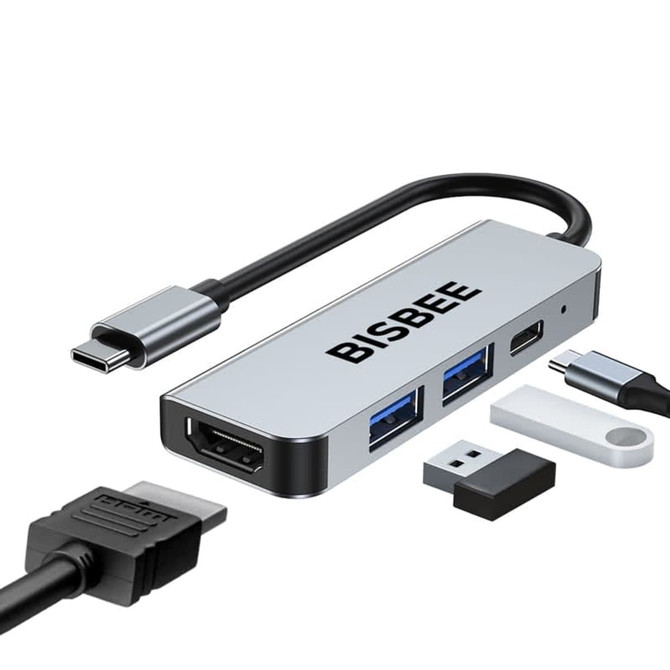 A silver USB hub with multiple ports, including HDMI and USB-A, and a Type-C cable. It has a logo.