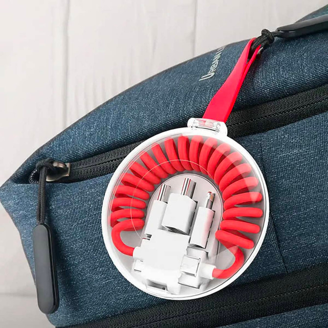 A curled red Type-C charge cable kit housed in a clear case, attached to a blue bag.