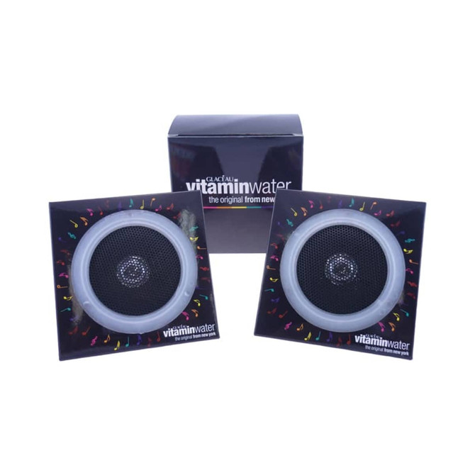 Pyramid Foldable Speakers in black and silver, displayed with branding in the background.