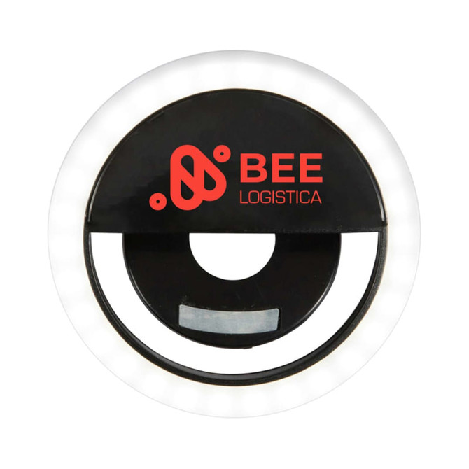 A round black LED selfie light with a glowing white rim and a logo in the centre.
