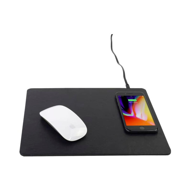 A black wireless charging mouse pad with a white mouse and a smartphone charging on its surface.