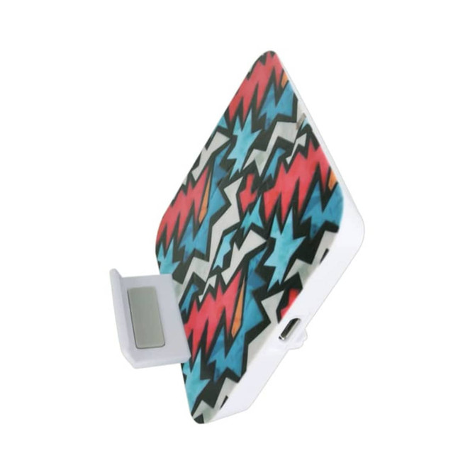A wireless charger stand featuring a vibrant design in red, blue, and white zigzag patterns. It includes a branding logo.