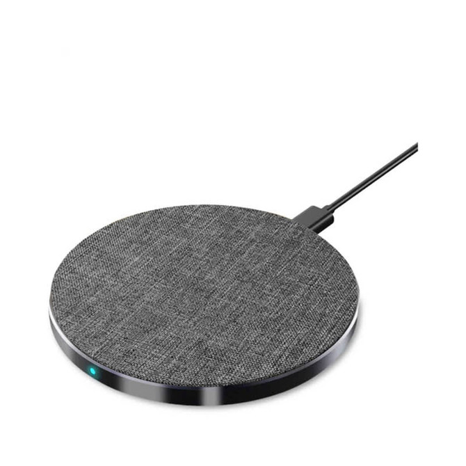 A round, grey wireless charger with a textured surface and a connecting cable. It features a small indicator light.