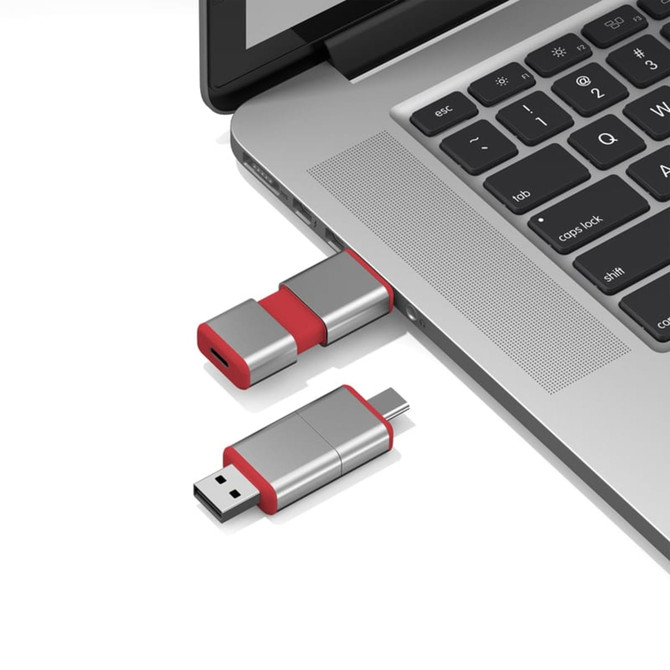 A silver and red Harris Type-C flash drive is plugged into a laptop USB port.