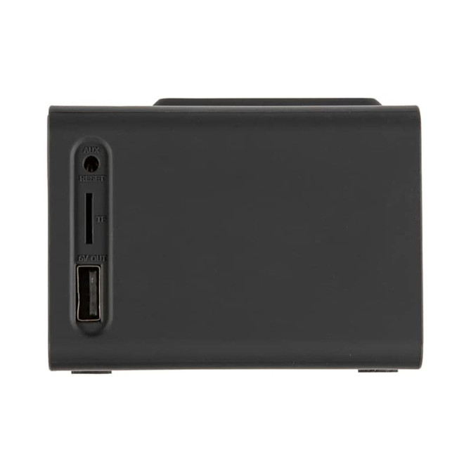 A black wireless charger speaker with ports for AUX, reset, and USB output on the side.