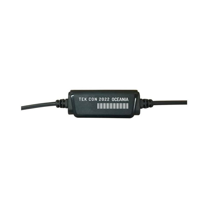 A black audio connector with wires, featuring a label with text and a barcode.