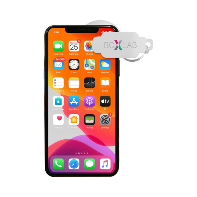 A smartphone with a vibrant orange background, featuring various app icons and a tag attached.