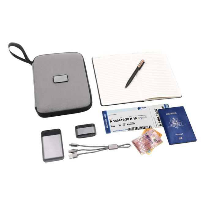 A grey travel wallet containing a notebook, pen, passport, boarding pass, cards, and charging cables.