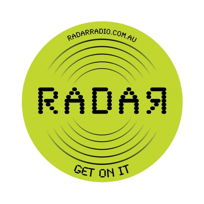 Bright green PVC coaster with a circular design featuring a logo and sound wave pattern.