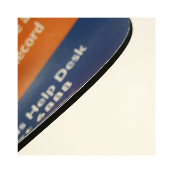 A close-up view of a Deluxe PVC mouse pad with a smooth edge and a combination of blue and orange colours.