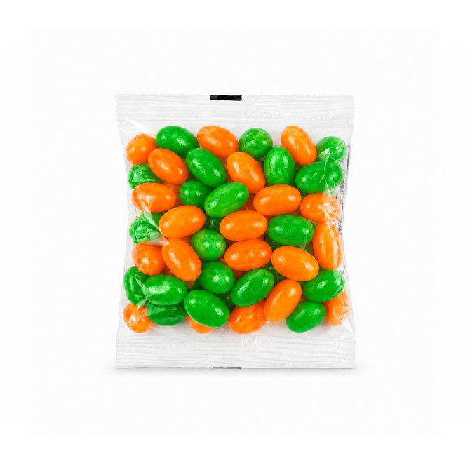 A cello bag filled with green and orange jelly beans. The bag contains a mix of vibrant, glossy candies.