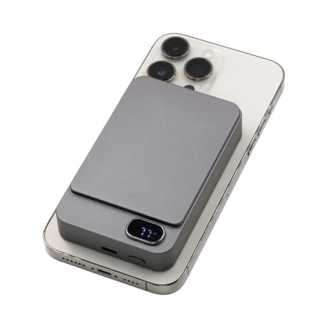 A grey Eco Magnetic Wireless Power Bank atop a smartphone, featuring a sleek, compact design and a logo.