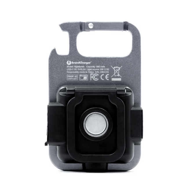 A black multi-tool featuring a COB LED light, a keyring attachment, and a branded logo.