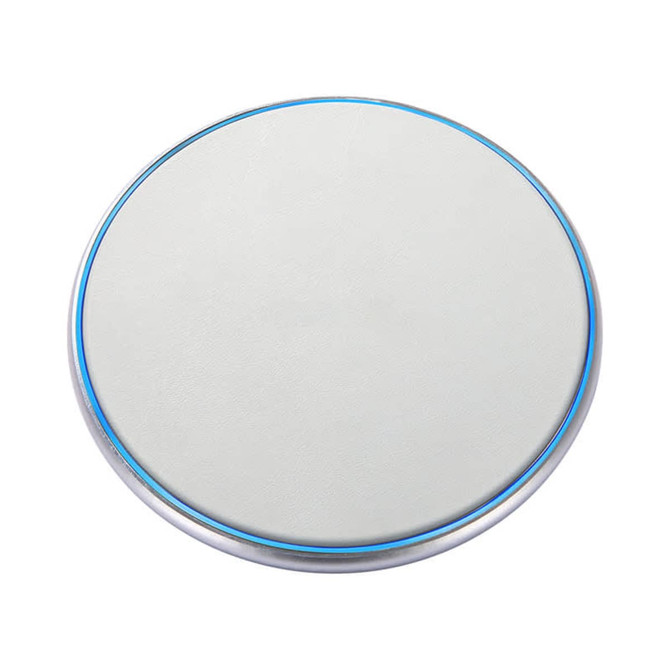 A round, silver-edged wireless charger with a smooth white surface and a blue light ring around the edge.