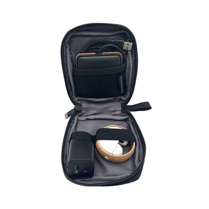 A black eco accessory pouch containing a charger, cables, and a small device, with a branded logo on the exterior.