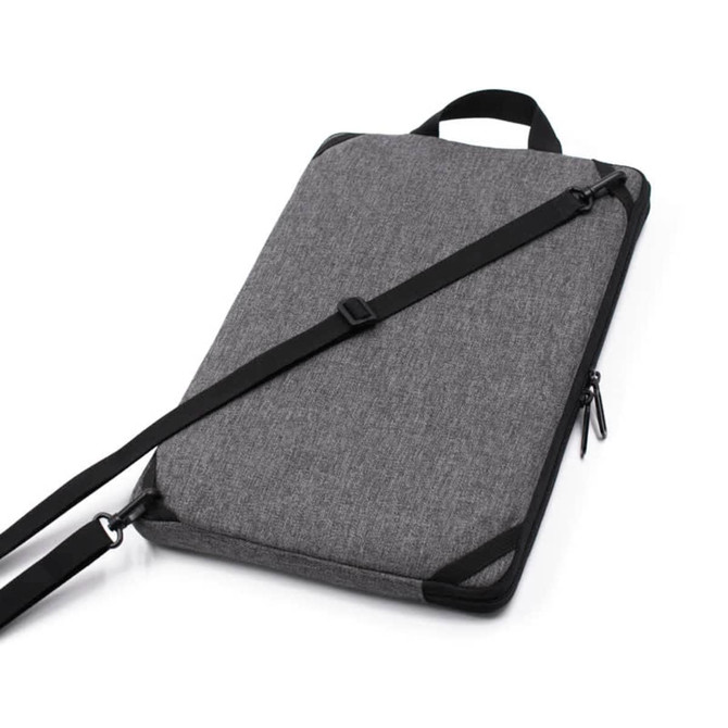 A grey laptop sling bag with a detachable strap and a zip closure, featuring a logo on the exterior.
