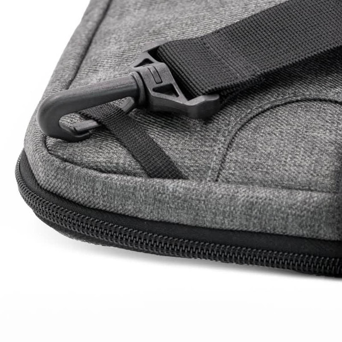 A grey laptop case featuring a zipper and a strap clip. It has a sleek, textured design.