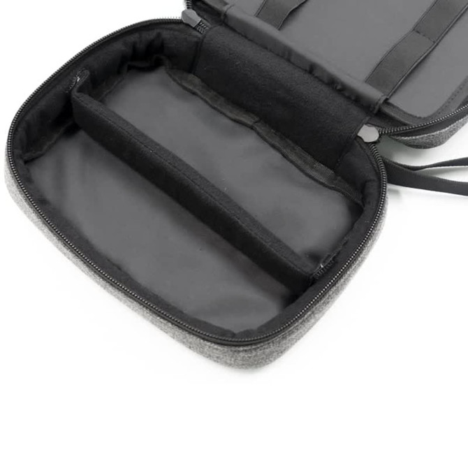 A grey toiletry bag with a zippered closure, featuring an interior pocket divider and a lined black interior.