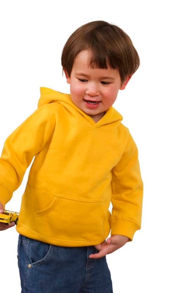 A toddler wearing a bright yellow fleece hoodie with a front pocket, set against a white background.