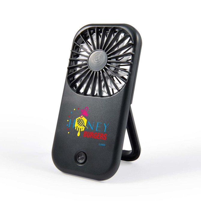 A portable fan with a sleek design featuring a branded logo. The fan includes a built-in stand for easy positioning.