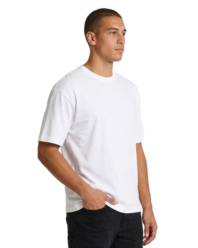 A white unisex loose-fitting t-shirt is displayed, featuring short sleeves and a simple design.