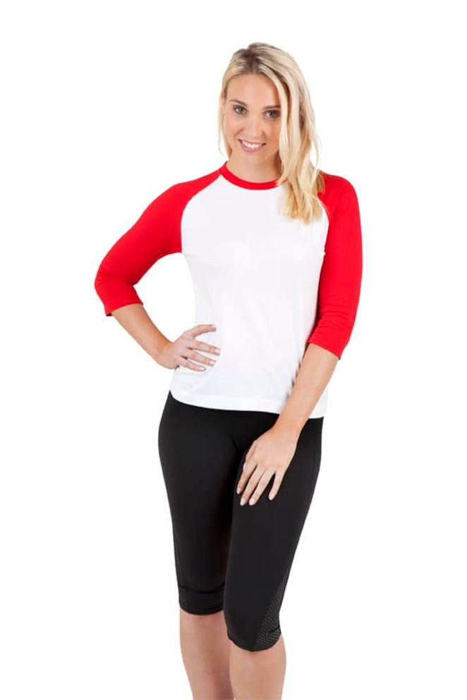 A women's 3/4 sleeve raglan T-shirt featuring red sleeves and a white body, paired with black shorts.