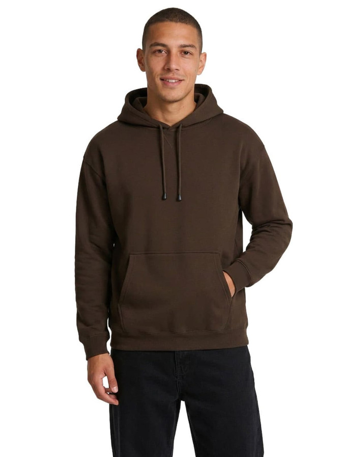 A light grey men's hoodie with a kangaroo pocket, worn by a young man standing casually.