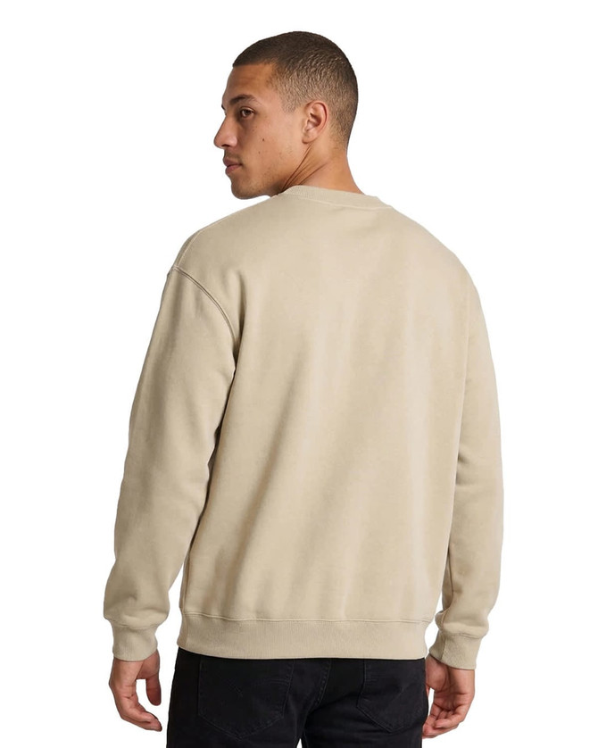A man wearing a beige poly cotton fleece jumper, viewed from the back, showcasing the garment's casual style.
