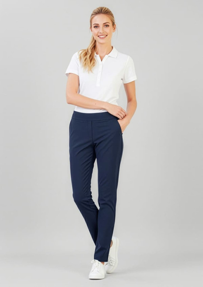 A pair of women's navy stretch pants with a slim fit, paired with a white polo shirt and white sneakers.
