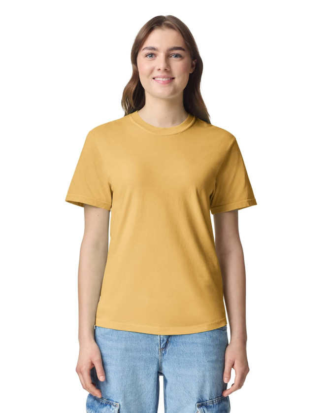 A yellow adult heavyweight T-shirt featuring a crew neck and short sleeves, presented on a model.