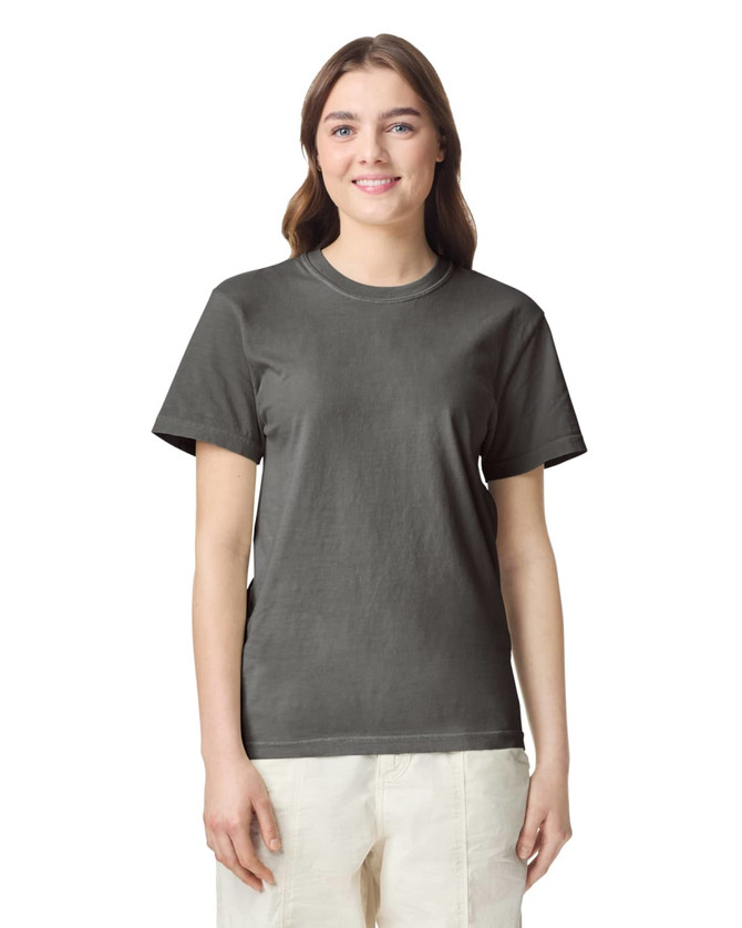 A grey heavyweight t-shirt displayed on a model with a simple design and logo detail.