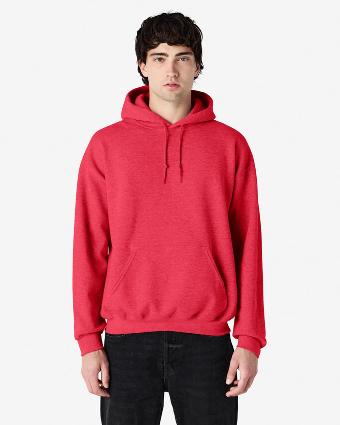 A red Gildan Heavy Blend hooded sweatshirt with a front pocket and drawstring hood, modelled by a person.