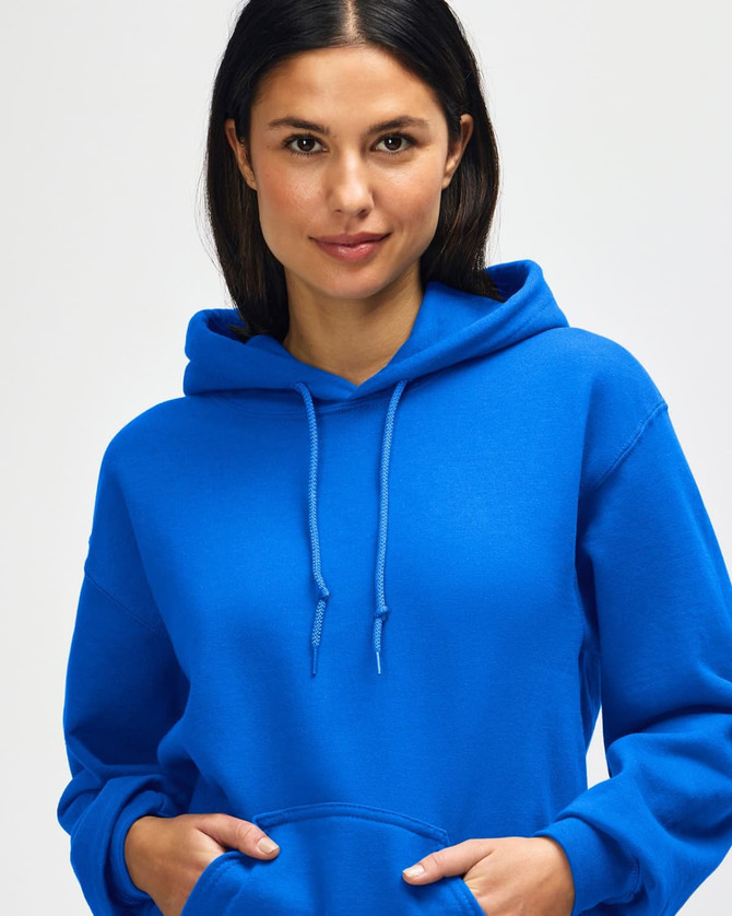 A blue hooded sweatshirt is worn by a model, featuring a drawstring and a branding logo.