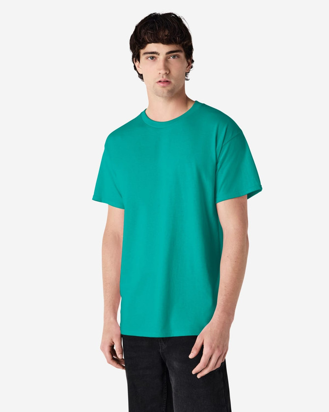 A man wearing a solid turquoise Gildan Ultra Cotton adult T-shirt, with a plain design and a visible logo.
