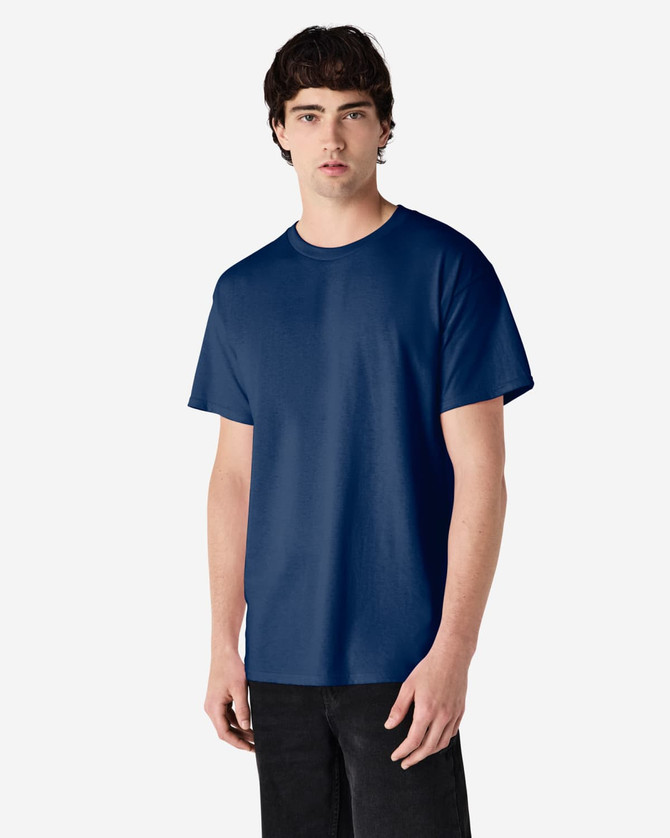 A model wearing a navy blue Gildan Ultra Cotton adult T-shirt. The shirt has a logo on it.
