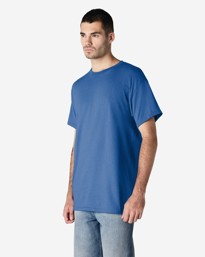 A blue Gildan Ultra Cotton adult T-shirt displayed on a model, featuring a relaxed fit and a logo.