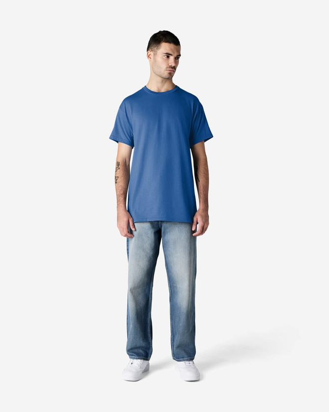 A blue Gildan Ultra Cotton adult t-shirt displayed on a model wearing light jeans and white shoes.