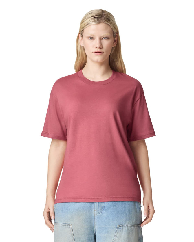 A unisex fine jersey short sleeve t-shirt in a pink colour, featuring a simple design and a logo on the front.