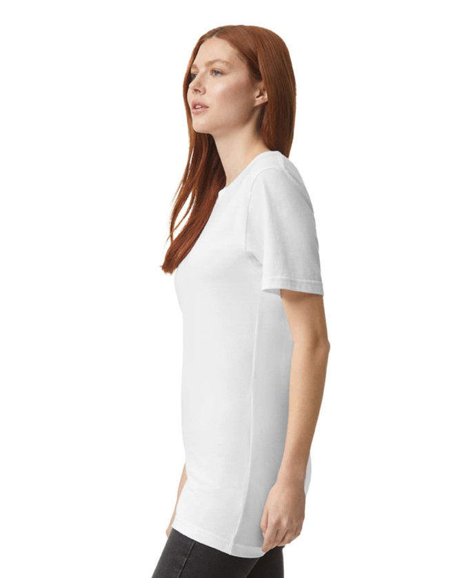 A white unisex fine jersey short sleeve t-shirt displayed on a model from the side. The shirt has a logo.