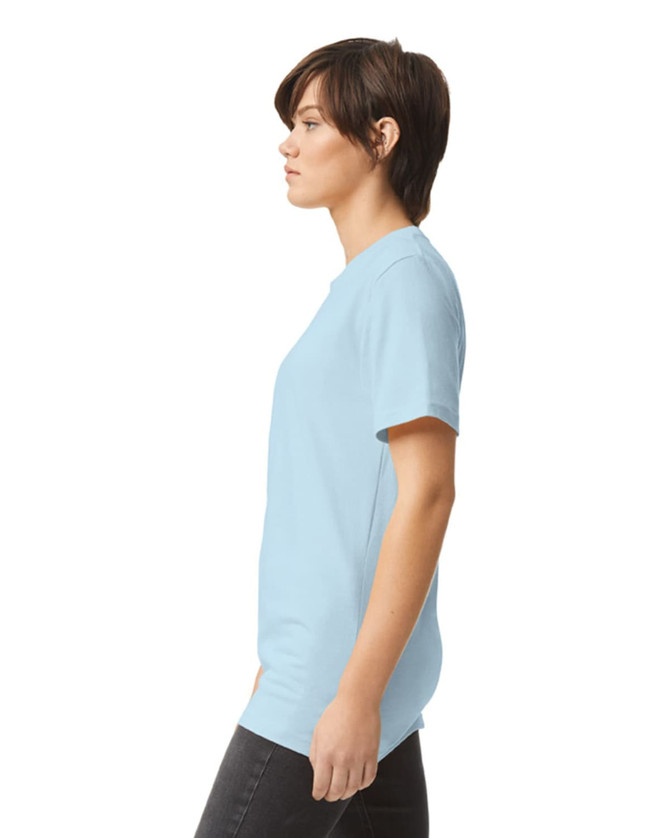 A unisex fine jersey short sleeve t-shirt in light blue, displayed on a model from a side angle.
