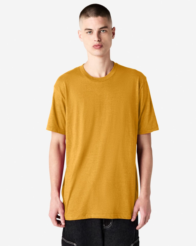 A unisex short sleeve t-shirt in a vibrant mustard colour, displayed on a model. It has a simple design and includes a logo.