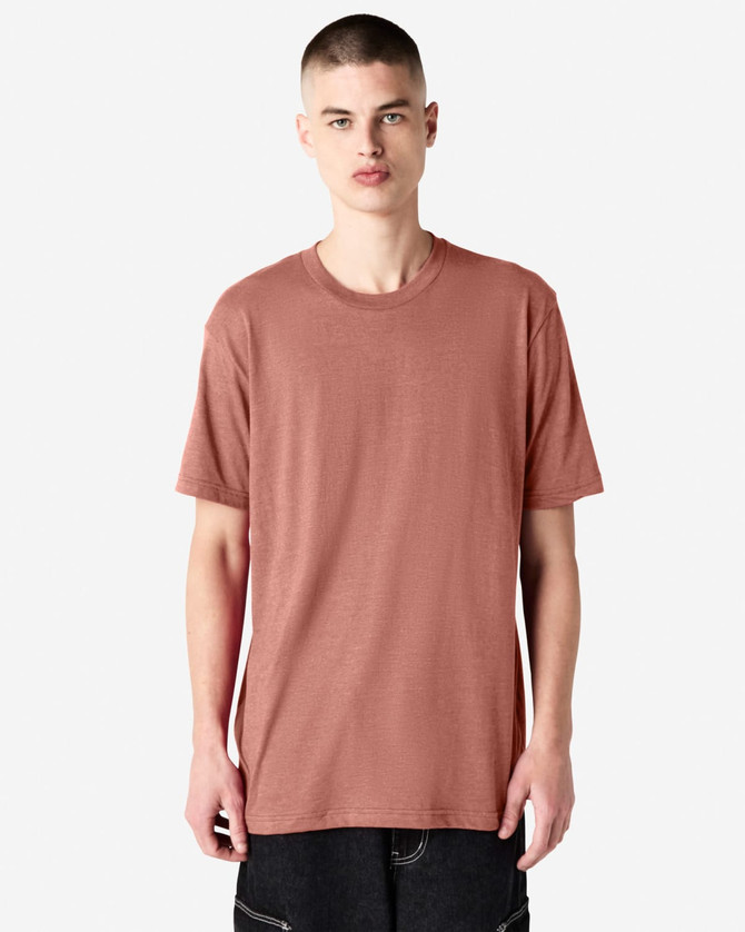 A unisex CVC short sleeve t-shirt in a muted reddish tone, featuring a simple design and a logo.