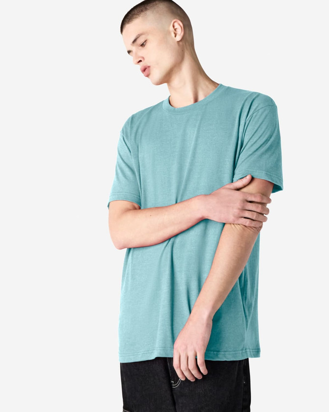 A unisex short sleeve t-shirt in a soft turquoise colour, featuring a logo on one side.