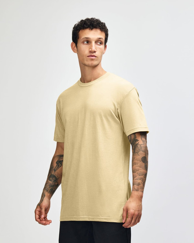 A unisex short sleeve t-shirt in a soft yellow colour, featuring a relaxed fit and a logo.