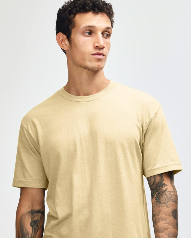 A unisex short sleeve t-shirt in a light yellow colour, featuring a simple design and a logo on the chest.