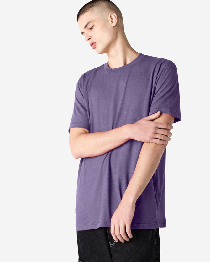 A unisex short sleeve t-shirt in a purple hue, featuring a simple design and a logo.